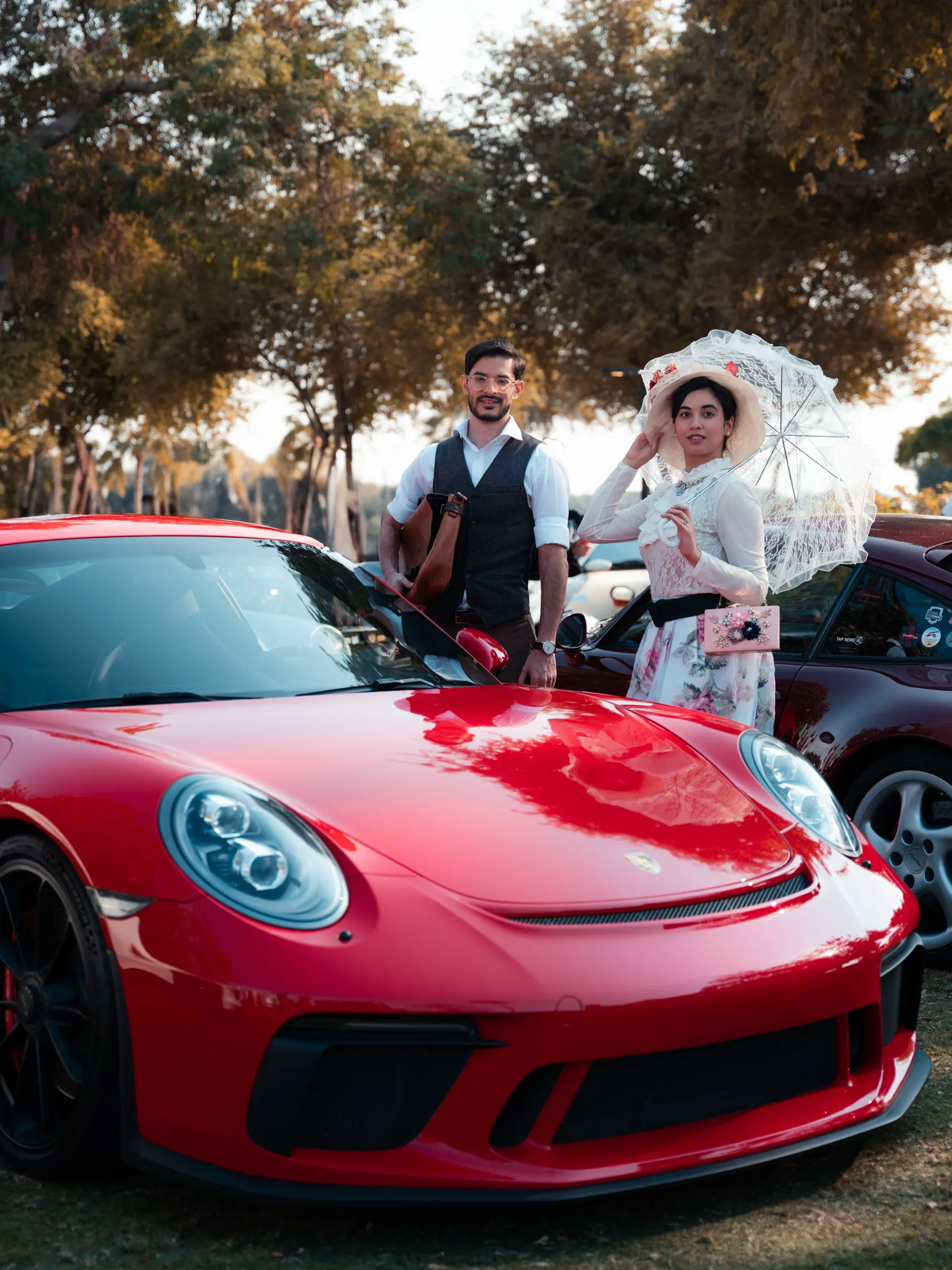 Supercar engine bay detail, carbon fiber and metallic parts.