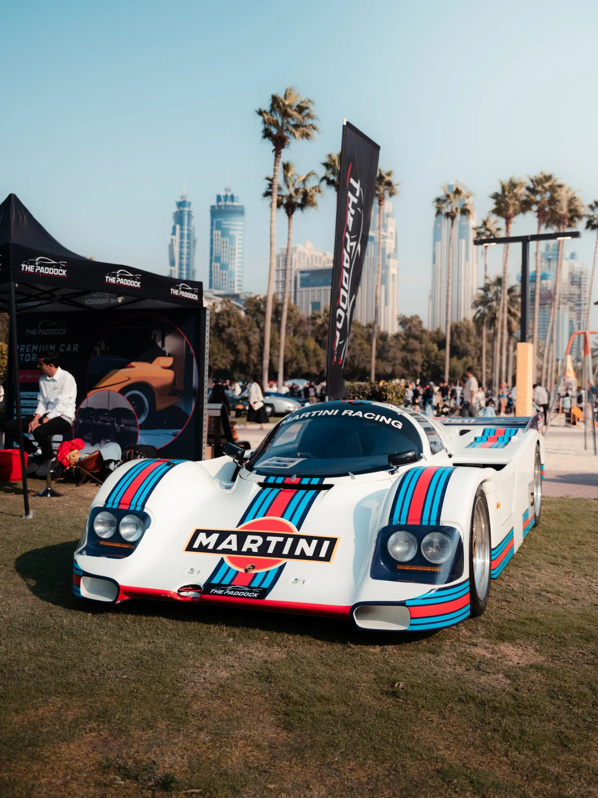 Martini Racing Porsche 917 reproduction at a car show in Dubai, bright daylight.