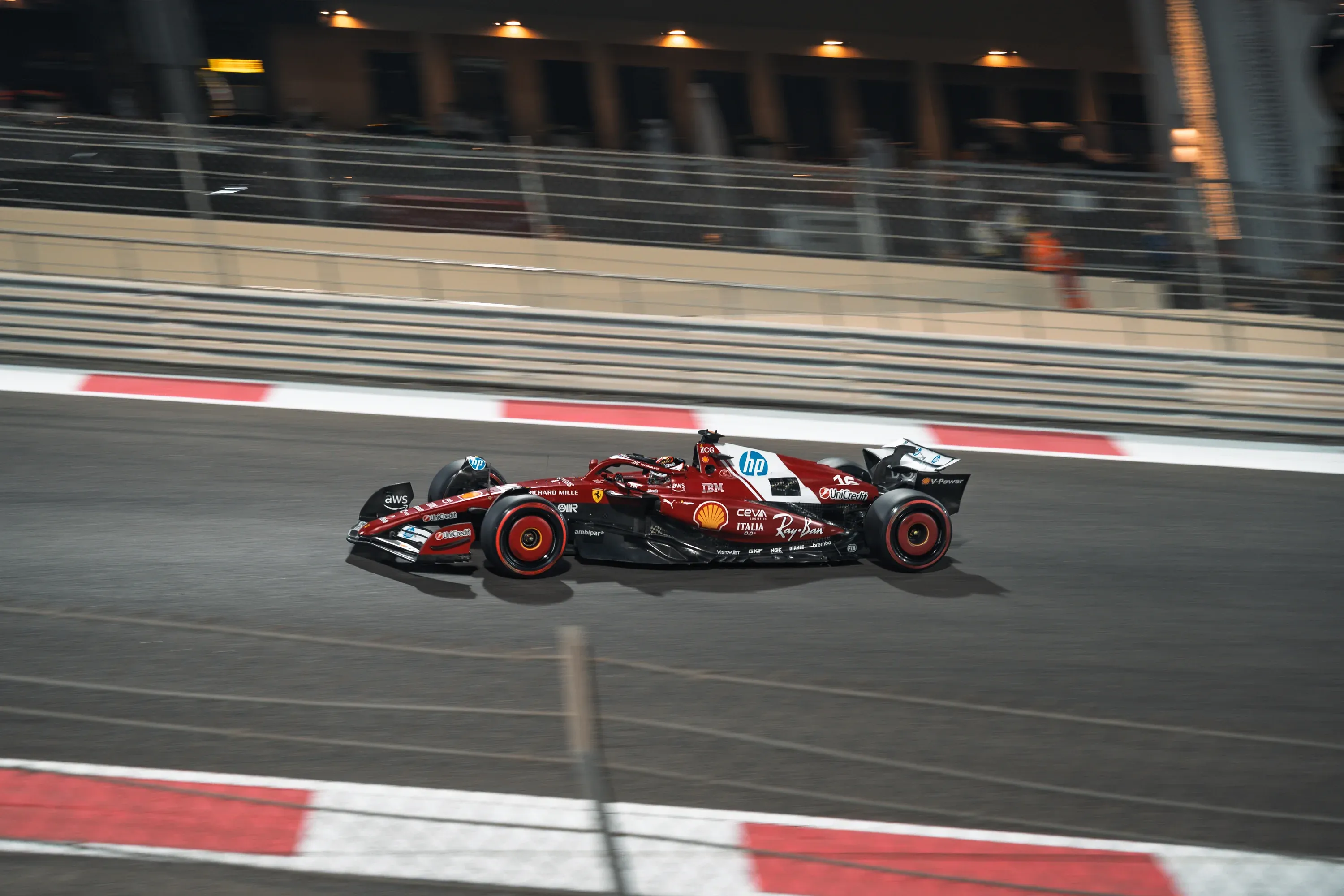 Night car meet with neon lights and urban backdrop.