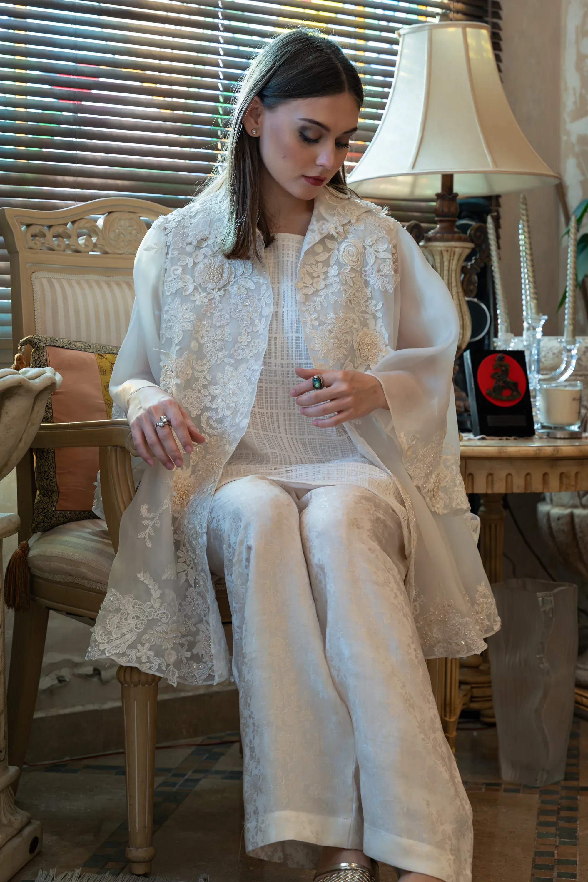 Close-up of fabric texture and intricate embroidery.