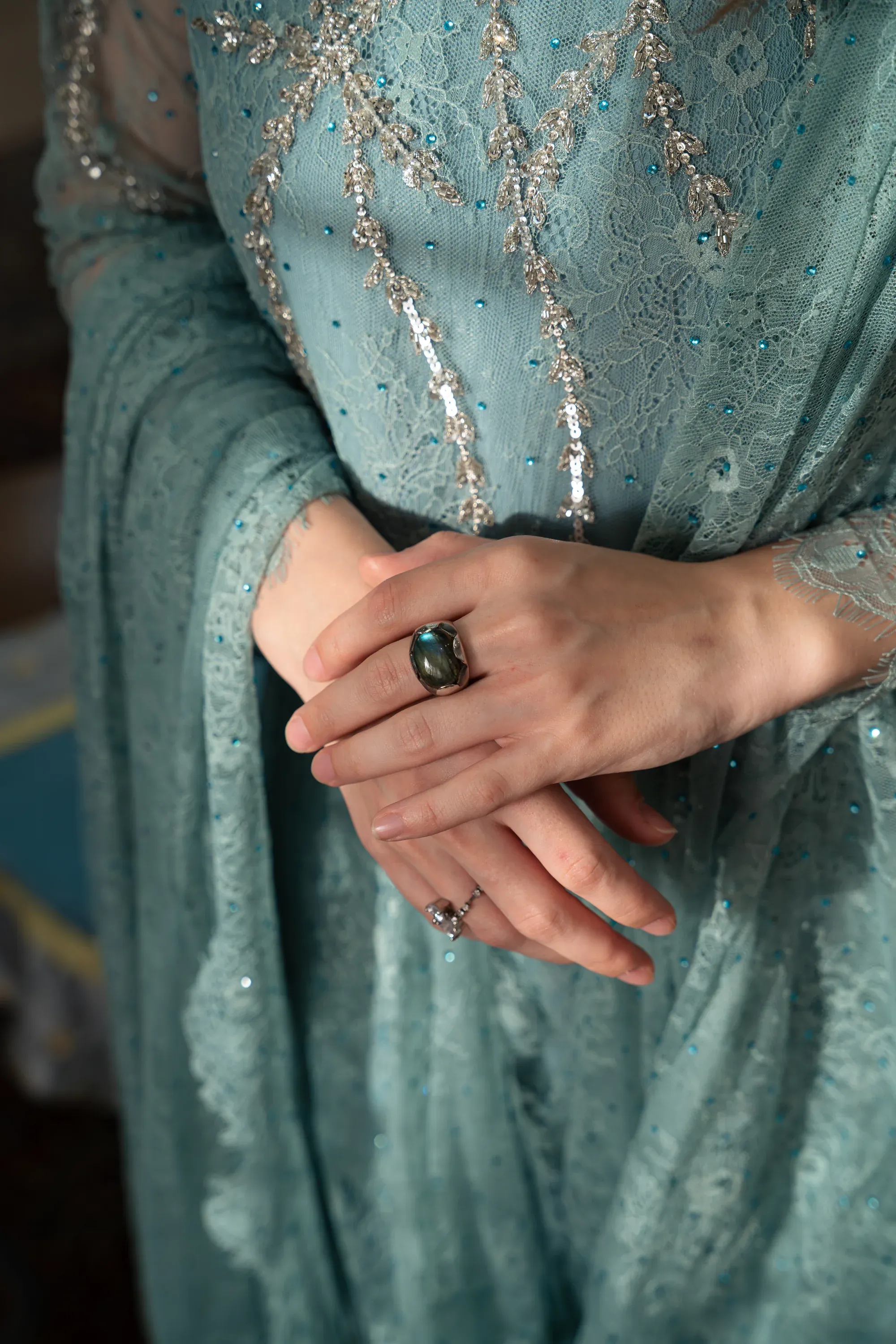 High-fashion portrait with dramatic shadows and highlights.