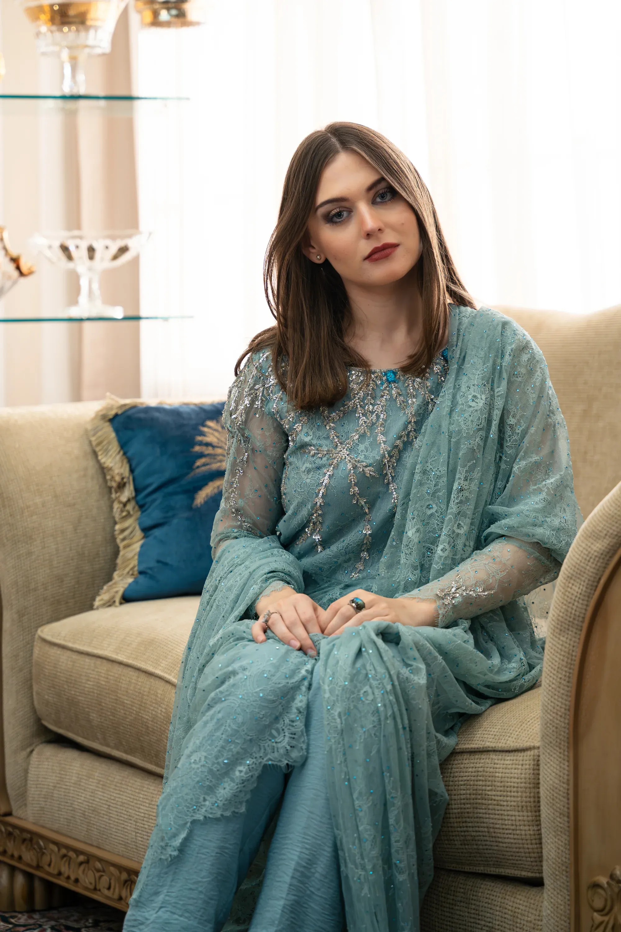 Evening in the city with glowing storefronts and traffic.